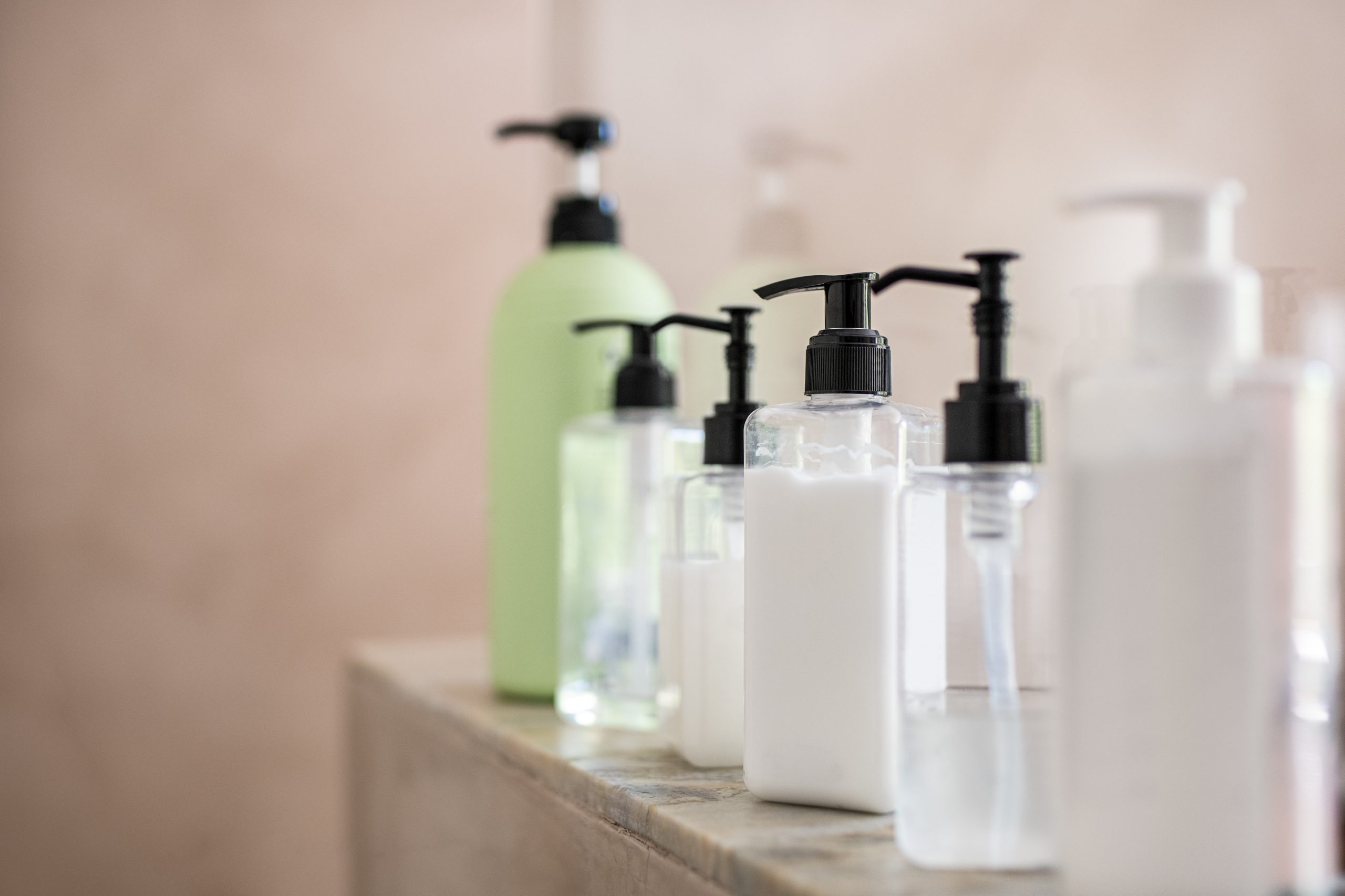 Dispenser bottles of moisturizer at spa